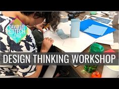 a woman sitting at a table working on something with the words, design thinking workshop