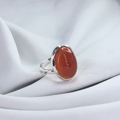 Carnelian Ring, Gemstone Ring, Oval Shape Carnelian Ring, Modern, Simple, Everyday, Gift, Gemstone Jewelry, Natural Stone, Stacking Ring Stone Name: Carnelian Primary Color : Silver Material : 925 Sterling Silver Shape: As Photo Stone Color: Red Explore our exquisite collection of handcrafted gemstone solid silver jewelry on Etsy. Each piece is meticulously designed and expertly crafted, ensuring a unique and timeless beauty. Our jewelry is made with genuine, high-quality gemstones set in solid Classic Carnelian Cabochon Rings, Polished Carnelian Oval Rings, Oval Cabochon Agate Ring With Polished Finish, Polished Agate Oval Cabochon Rings, Classic Orange Oval Cabochon Rings, Carnelian Cabochon Ring As Gift, Carnelian Cabochon Ring Gift, Oval Carnelian Orange Ring, Oval Amber Cabochon Ring