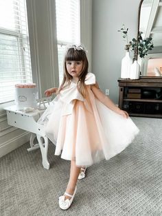 Petite Maison Kids. Made in Turkey. Dress is made of many layers of Soft Tulle. Large Bow in front with rhinestone embellishment. Back zipper closure. Color is Peach. Peach Color Dress, Jackie Dress, Flower Girl Gown, Shape Dress, Girls Dress Outfits, Peach Dress, Bow Collar, Soft Tulle