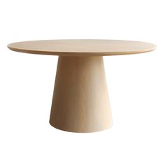 a round wooden table sitting on top of a white floor