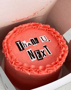 a red cake with the words thank you next on it