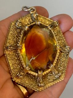 Large gold tone brutalist style pendant heavy large central bi colours citrine crystal  style stone set with large claws for secure setting Citrine Crystal, Stone Pendant, Stone Settings, Stone Pendants, Pendant Necklaces, Citrine, Stone Color, Halloween Shopping, Jewelry Necklace Pendant