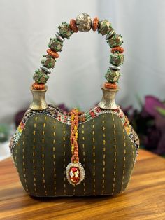 This rare vintage Mary Frances beaded mini bag is a true work of art, featuring exquisite exotic embellishments that make it a one-of-a-kind accessory. Intricately crafted with an array of colorful beads, this stunning bag showcases Mary Frances' signature flair for unique, ornate designs. The exotic embellishments include delicate beadwork, sequins, and intricate patterns that give the bag an eye-catching appeal. Perfect for special occasions or as a collectible, this mini bag is a statement piece that will add a touch of glamour and artistry to your outfit. Its petite size makes it ideal for carrying essentials like lipstick, keys, and cards while exuding elegance and charm. Rare vintage Mary Frances beaded mini bag Features exotic embellishments and intricate beadwork Unique and ornate Mary Frances Bags, Mary Frances Handbags, Mary Frances, Artist Style, Intricate Patterns, Vintage Bags, Petite Size, Vintage Finds, Statement Pieces