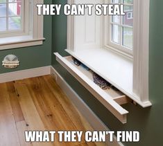 an empty window sill in the corner of a room with wood floors and green walls