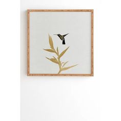 a bird flying in the air over a plant with leaves on it's back