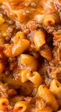 pasta with meat and sauce in a white bowl