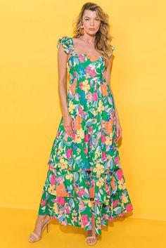 Channeling summer vibes, this airy dress is ideal for sunny days and beach adventures. The flowy fit is complemented by a playful ruffled shoulder strap, adding an extra touch of movement and visual appeal. The vivid floral print adds a pop of color and a fun, fresh feeling. With its high waist design, this dress flatters curves and creates a feminine silhouette. 100%Polyester Size Chart (INCH) Sizes Bust Waist Hem_Width Length Shoulder_Girdle Relax Relax Relax Relax Relax S 31.5 25.6 105.3 53.9 Summer Tropical Print Floral Dress For Garden Party, Floral Print Maxi Dress For Garden Party Vacation, Summer Floral Dress With Tropical Print For Garden Party, Casual Floral Dress With Vibrant Print For Brunch, Casual Floral Dress With Vibrant Print For Day Out, Multicolor Floral Sundress For Beach Season, Multicolor Summer Floral Dress With Vibrant Print, Tropical Print Dress For Garden Party Vacation, Sleeveless Ruffled Sundress For Summer Outings