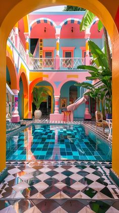 an indoor swimming pool surrounded by multicolored walls and tiled floors, with a pink flamingo in the center