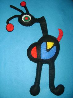 an image of a cat made out of paper on a blue background with red and yellow circles