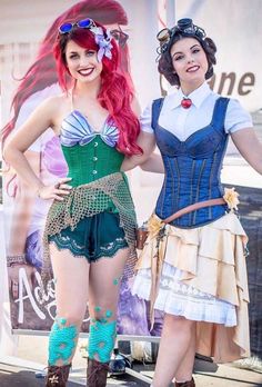 two women dressed up as disney princesses posing for the camera with their hands on each other's hips