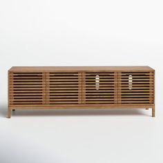 the sideboard is made out of wood and has two doors on each side, with three