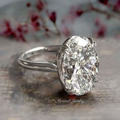 an oval cut diamond sits on top of a table