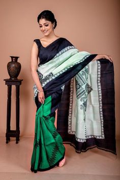 There are different motifs present in the saree. Also, they are not similar to each other. A tribal style of hand block printing is in this never seen combination of mulberry silk saree. This bottle green silk saree itself represents the tribal motifs. The color compliments the beautiful tribal print in this pure silk saree. Also, the saree is silk mark certified. Hence, you don't have to worry about the quality of this printed silk saree. The fashion craze is all about following the latest trends. Also, this saree never gets out of trend. Hence, it is the most treasured outfit for the fashion buffs like you which you can sport whenever you like to. Beyond any limitations This bottle green silk saree is beyond any limitations. It has a very sober and subtle color. We have spotted many wome Black Block Print Blouse Piece For Diwali, Black Blouse Piece With Block Print For Diwali, Diwali Black Blouse Piece With Block Print, Black Block Print Saree With Traditional Drape, Traditional Green Pre-draped Saree With Kalamkari Print, Black Saree With Block Print And Traditional Drape, Black Traditional Wear With Block Print, Transitional Bohemian Pre-draped Saree With Traditional Patterns, Black Block Print Blouse Piece For Navratri