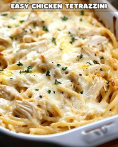 an easy chicken tetrazzini casserole is shown in a white dish