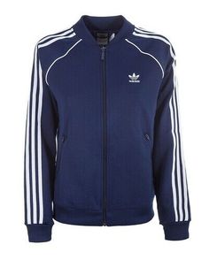 Included in this listing is the WOMEN'S SUPERSTAR TRACK TOP JACKET from ADIDAS ORIGINALS. This jacket is featured in DARK BLUE. Women's size MEDIUM, LARGE or X-LARGE. Brand new with tags.  All items come from a smoke-free and pet-free environment.  Please know your size, view all photos and ask all questions before bidding.  Description from Adidas: "The best of Adidas past, remastered for the present. The SST track jacket was originally designed for tennis court warm-ups. This version is made o Adidas Track Top Outfit, Adidas Blue Jacket, Adidas Blue Outerwear With Three Stripes, Adidas Blue Outerwear With Three Stripes Branding, Navy Adidas Track Jacket For Sports, Adidas Navy Track Jacket For Sports, Adidas Blue Track Jacket With Three Stripes, Adidas Blue Track Jacket For Streetwear, Blue Sporty Track Jacket For College