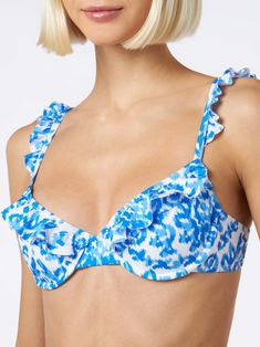 Woman bralette swimsuit with rufflesBluette patterns on white backgroundComposition:90% polyamide 10% elastane Fitted Underwire Swimwear With Ruffles, Fitted Underwire Ruffle Swimwear, Fitted Ruffled Underwire Swimwear, White Ruffled Straps Swimwear For Poolside, Summer Swimwear With Ruffles And Underwire, Beachwear Swimwear With Adjustable Ruffled Straps, Ruffled Underwire Swimwear For Vacation, Underwire Ruffled Swimwear For Vacation, Blue Swimwear With Ruffled Straps For Poolside