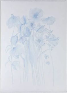 a drawing of blue flowers in a white frame on a wall with the bottom half painted off