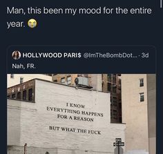 an old building with the words hollywood paris on it's side and another sign that reads, man, this is been my mood for the entire year