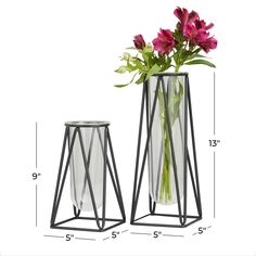 The unique and bold design of this set of vases makes it an instant conversation piece and a gorgeous accent decor for your home. This item ships in 1 carton. The slender design of this vase makes it ideal to hold a single flower stem, or as a decorative accent piece in your home. Glass vase makes a great gift for any occasion. Suitable for indoor use only. This item ships fully assembled in one piece. This black colored vase comes as a set of 2. Modern style. Vases have a 3 in, and 3 in mouth openings. Grayson Lane 2-Pack Black Iron Modern Vase | 58740 Mirrored Table, Modern Glass Vases, Nordic Vase, Vases For Flowers, Test Tube Vase, Cosmoliving By Cosmopolitan, Colored Vases, Geometric Inspiration, Glass Flower Vases