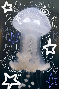 a jellyfish is floating in the water with stars around it