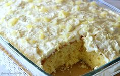 a cake that has been cut into pieces and is sitting in a pan on the table