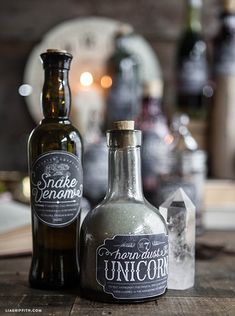 two bottles sitting on top of a wooden table