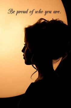 a woman is silhouetted against the sun with her hair pulled back