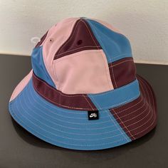 Nike Patchwork Bucket Hat Multicolor Patchwork Casual Hat, Casual Multicolor Patchwork Hat, Blue Flat Brim Bucket Hat One Size, Blue Flat Brim Bucket Hat, Retro Blue Bucket Hat, Casual Multicolor Six-panel Hat, Blue Retro Bucket Hat With Curved Brim, Retro Blue Bucket Hat With Curved Brim, Blue Bucket Hat For Streetwear