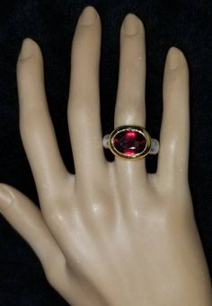 GORGEOUS ITALIAN DESIGN 18K YELLOW WHITE GOLD GARNET RING CENTER NATURAL RED GARNET IN OVAL SHAPE WEIGHT 8.73CARAT SIZE 13X11 GORGEOUS RED GARNET CLEAN ,VERY NICE CUT ,LIVELY STONE.NICE LUSTER. RING size 8 Ring weighs 13.5 grams Ring face size 17.6mm east to west Ring face size 14.7mm north to south Retail value $7,500 net . Appraisal available Luxury Oval Ruby Ring For Anniversary, Luxury Oval Ruby Ring For Formal Occasions, Luxury Oval Ruby Ring With Gemstone, Luxury Oval Ruby Ring With Accent Stones, Luxury High Luster Gemstones For Formal Occasions, Luxury Oval Yellow Gold Ruby Ring, Luxury Oval Ruby Ring In Yellow Gold, Luxury Oval Ruby Ring In Gold, Luxury Yellow Gold Oval Ruby Ring