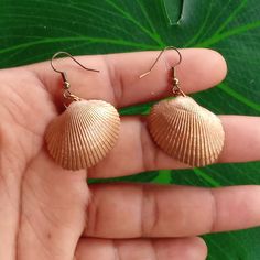 Bronze painted seashell earrings. From start to finish and glossed for protection. Pieces of jewelry created and well crafted for you to wear anywhere and everywhere!! I really like putting effort into these cause they come out looking so nice and shiny. I used gold stainless steel earring hooks so they would match the color just right. :) Shell-shaped Earrings For Beach Season Gift, Shell Earrings For Beach Season Gift, Beachy Shell Dangle Earrings, Beach Season Shell Earrings Gift, Beach Season Gift Shell Earrings, Shell Drop Earrings For The Beach, Beachy Shell-shaped Earrings For Gift, Handmade Shell Earrings For Beach Season, Handmade Shell-shaped Beachy Earrings