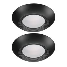 two black ceiling lights with white trims