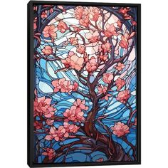 a tree with pink flowers in front of a stained glass wall hanging on a wall