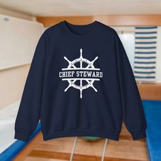 Chief Steward and Ship's Wheel bold letter sailor varsity sweater ----------------------------------------------------------------------------------------------------------- ⚓ Comfort Redefined: Made from a luxurious blend of 50% cotton and 50% polyester, this medium-heavy fabric (8.0 oz/yd²) feels like a warm hug on those chilly sea nights. The ribbed knit collar ensures that it stays shipshape, retaining its form even after battling the waves and a run through the laundry. 👕 Durability Meets Style: The classic fit and crew neckline provide a comfy, clean-cut style that suits any maritime occasion. Double-needle stitching at the shoulder, armhole, neck, waistband, and cuff seams guarantees top-tier durability - ready to withstand the toughest storms and still look shipshape. 🌱 Eco-Frien Chief Sustainability Officer, Navy Chief Selectee Gifts, Christopher Ward C63 Sealander Gmt, Navy Chief, Chief Petty Officer, Varsity Sweater, Ship Wheel, Warm Hug, 2024 Vision