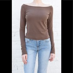 Cotton Blend Off The Shoulder Long-Sleeve Top With A Raw Hem. Fabrics: 96% Cotton, 4% Elastane Measurement: 19"(48 Cm) Length, 18"(46 Cm) Bust Made In: Italy Fitted Casual Long Sleeve Top For Fall, Fitted Casual Long Sleeve Top For Spring, Fitted Long Sleeve Blouse For Everyday, Casual Fitted Blouse For Fall, Fitted Long Sleeve Top For Fall Day Out, Brown Stretch Long Sleeve Top For Spring, Spring Stretch Brown Long Sleeve Top, Fitted Brown Long Sleeve Top Casual, Trendy Brown Long Sleeve Top For Spring