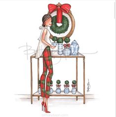 a watercolor painting of a woman decorating a christmas wreath