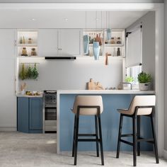 two bar stools sit in front of an island with blue cabinets and white countertops