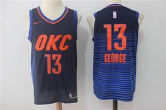 two basketball jerseys that are sitting on a mannequins head stand, one is blue and the other is orange