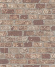 a brick wall with brown and tan bricks