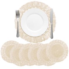 a set of placemats, plates and silverware on a white background