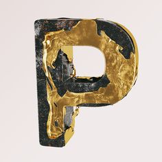 the letter p is made up of gold and black paint