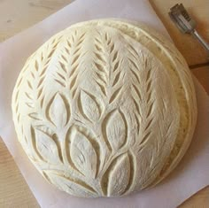 a round pastry sitting on top of a piece of paper