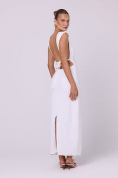 Designed to captivate, the Lila Maxi Dress in an alluring white shade is destined to be a timeless staple. Crafted from a comfortable spandex blend, this dress elegantly contours the body, highlighting your curves with a flattering fit. The open-back detail adds a touch of drama, ensuring you'll leave a lasting impression wherever you go.   Colour: White Maxi length Backless with tie detail Boat-neck Fully lined 97% Polyester 3% Spandex Hand wash only and rinse in cold water Do not bleach or tumble dry Steam or iron on low heat before wear Dress Elegantly, Maxi Dress White, Backless Maxi Dress, Stocking Fillers For Her, Boat Neck Dress, Holiday Party Outfit, Backless Maxi Dresses, Knitwear Dress, White Maxi