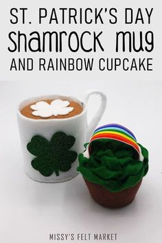 there is a cupcake next to a mug with shamrocks on it and the words st patrick's day shamrock mug and rainbow cupcake