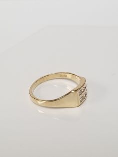 "Thanks for shopping our vintage estate store. We tend to sell well below wholesale and truly hope you enjoy all of our items. Many of the items are one of a kind, so please enjoy scrolling through the pictures and hopefully something will catch your eye. Brown spots are from camera or reflections. Estate 10k yellow gold .10ct cz diamond midi or pinky ring. There are 6 small cz diamonds in the setting. Ring size: 3 Inside ring: 14.5mm Setting: 5.5mm 1/4\" Band width: 2mm Weight: 1.12 grams Very Classic 14k Gold Signet Ring With Diamond Accents, Classic Gold Engraved Ring With Diamond Accents, Vintage Yellow Gold Diamond Signet Ring, Classic Gold Engraved Birthstone Ring, Vintage Diamond Birthstone Ring, Hallmarked, Vintage Signet Ring With Diamond Accents For Formal Occasions, Vintage Signet Ring With Diamond Accents For Formal Events, Vintage Diamond Birthstone Ring Hallmarked, Vintage Formal Signet Ring With Diamond Accents