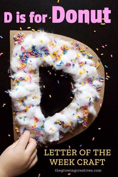 a doughnut with sprinkles on it and the letter d is for donut