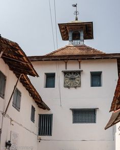 an old building with a clock on the front