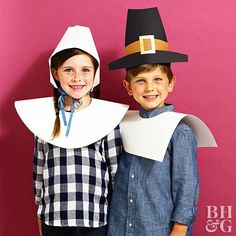 two children in costumes standing next to each other