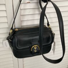 This Bag Is Brand New With Tag Attached It Is Style Number F25150 Leather Crossbody Camera Bag Original Retail $258 It Has A Flap In Front With Magnetic Snap Closure, It Has A Zip Top Opening With An Inner Zip Pocket And Two Open Side Pockets. Dimensions Are Approx 8.5 X 5 X 4 With Strap Drop Length Of 25 In Elegant Black Camera Shoulder Bag, Elegant Black Shoulder Camera Bag, Evening Camera Bag With Detachable Strap, Elegant Black Camera Bag With Removable Pouch, Chic Black Camera Shoulder Bag, Chic Black Shoulder Camera Bag, Classic Black Shoulder Camera Bag, Evening Camera Bag With Removable Pouch, Chic Black Satchel Camera Bag