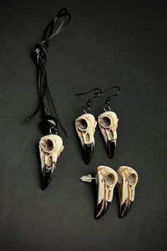 The Gothic Crow Skull Necklace & Earring Set is a perfect blend of dark elegance and handmade craftsmanship. This set features both stud and dangle bird earrings, paired with a striking crow skull necklace that captures the mysterious beauty of an animal skull. With its gothic decor vibe, this gothic necklace and earring set is ideal for those who love dark academia and Halloween jewelry. Whether you're embracing the spooky season or simply drawn to gothic earrings for everyday style, this set makes a bold, hauntingly beautiful statement. Since each piece is lovingly handmade to order, you might find slight variations in shape, color, or pattern compared to the photo. But that's the charm of handcrafted creations - they're all unique!  Measures: Crow Skull Length: 3.2cm; Width: 1.2cm; Sinc Love Dark Academia, Mysterious Beauty, Love Dark, Dark Elegance, Crow Skull, Animal Skull, Ancient Egyptian Gods, Gothic Earrings, Gothic Necklace