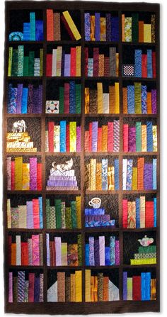 a book shelf filled with lots of books covered in multicolored paper and thread